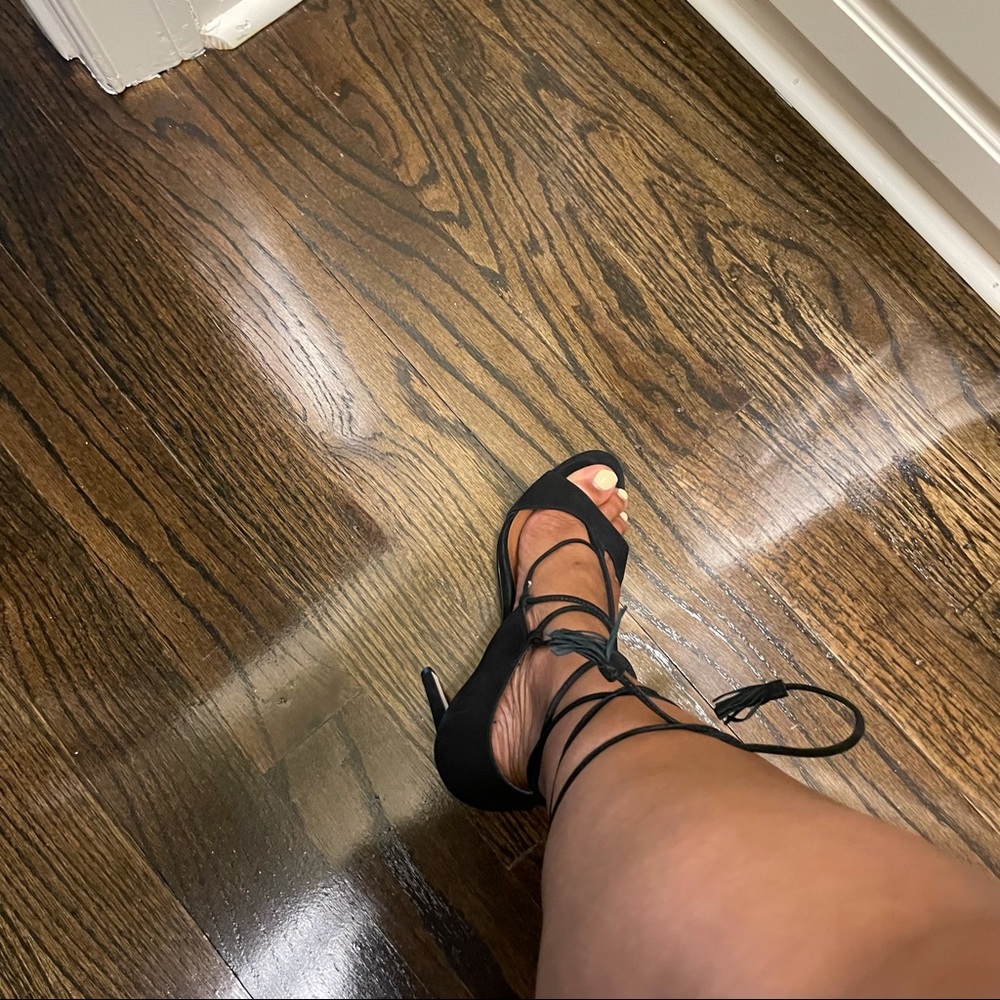 Gently used black Steve Madden strap tie heels.